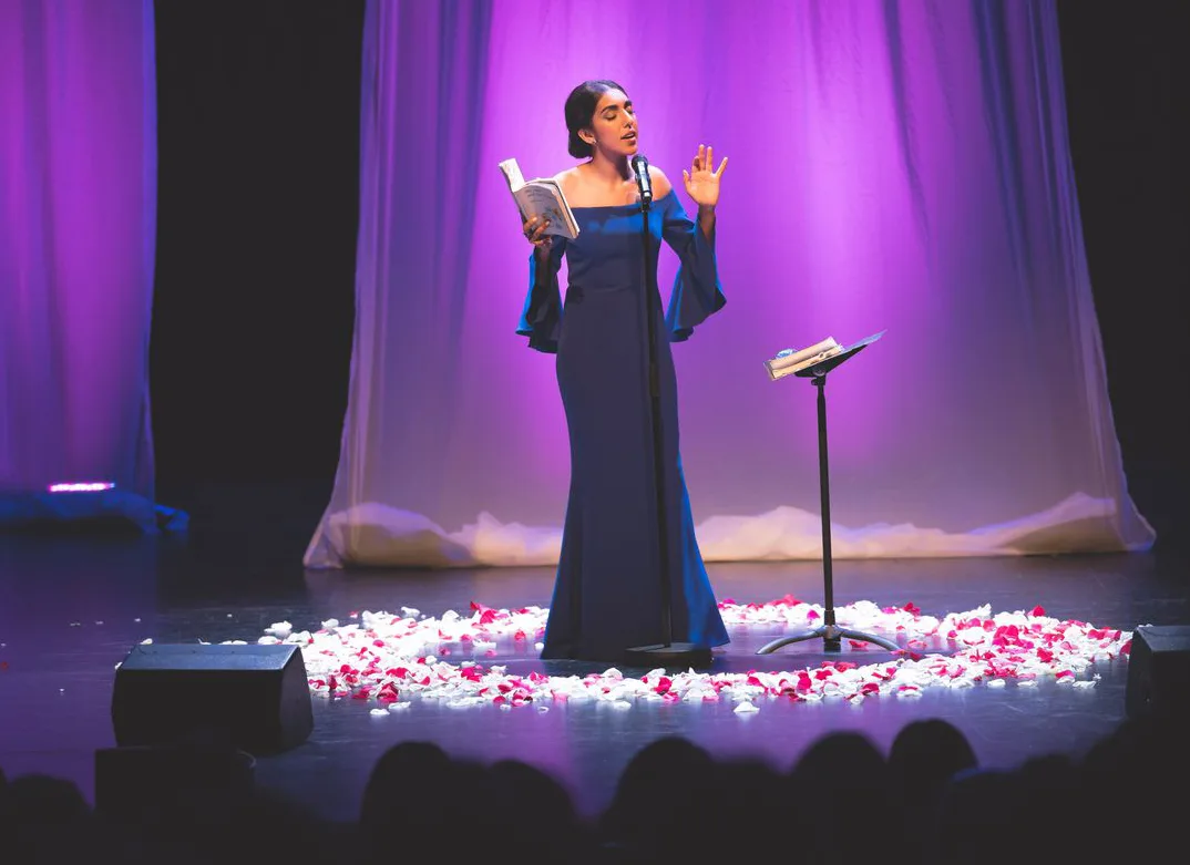 Kalaam e Virsaa – poetic performance on stage with rose petals